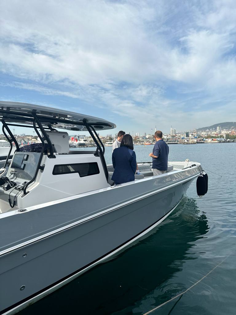 A group of people standing on a boat from Aldhaen Marine